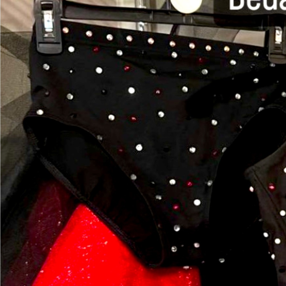 Dance briefs stoned with a red and black bustle